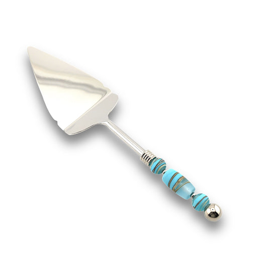 A stainless steel pie server with a handle featuring handcrafted glass beads in various colors.