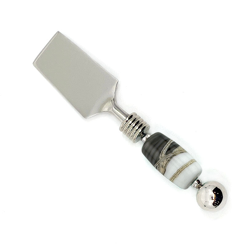 Cheese knife with a decorative handle on a white background