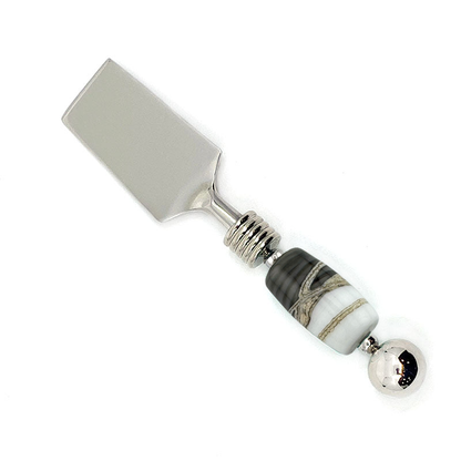 Cheese knife with a decorative handle on a white background