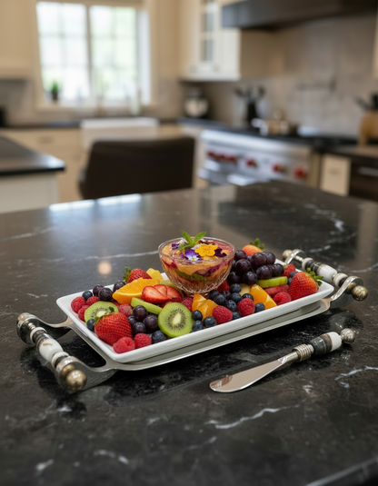 Fruit platter with a bowl of fruit spread on a kitchen counter