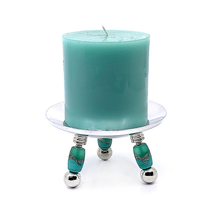 "Handcrafted glass bead candle holder, adding artisanal elegance and charm to home decor. Perfect for creating ambiance and lighting in any space. Ideal for use as a table centerpiece or to enhance living room decor with its mesmerizing display. Sophisticated design exuding timeless elegance and handcrafted beauty."