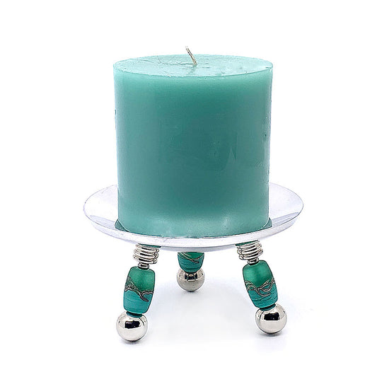"Handcrafted glass bead candle holder, adding artisanal elegance and charm to home decor. Perfect for creating ambiance and lighting in any space. Ideal for use as a table centerpiece or to enhance living room decor with its mesmerizing display. Sophisticated design exuding timeless elegance and handcrafted beauty."
