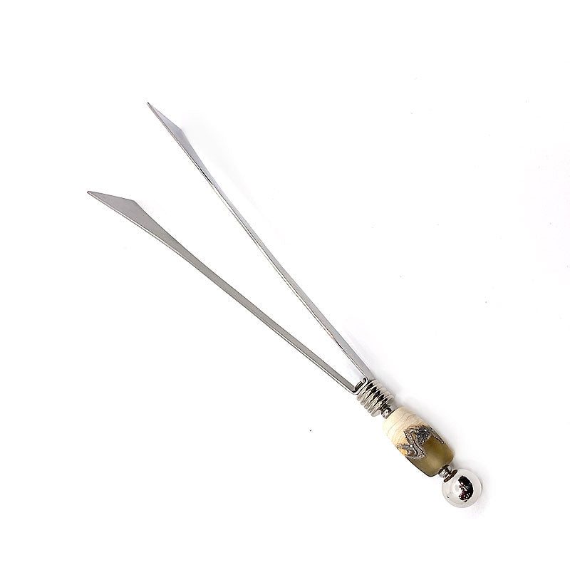 Handcrafted serving tongs with glass bead embellishments, crafted with precision from stainless steel for effortless handling and precise serving. Ideal for formal dinners or casual meals, adding sophistication to any table setting.