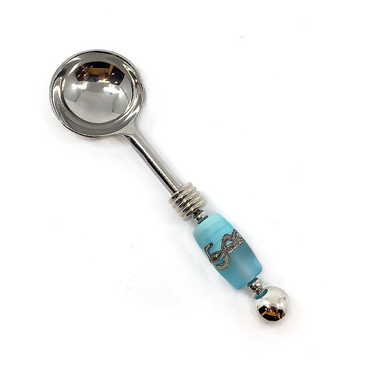 Handmade Glass Bead Round Spoon with stainless steel construction and delicate bead embellishments. Ideal for serving condiments, sauces, or garnishes with sophistication. Adds charm and visual appeal to any culinary occasion.